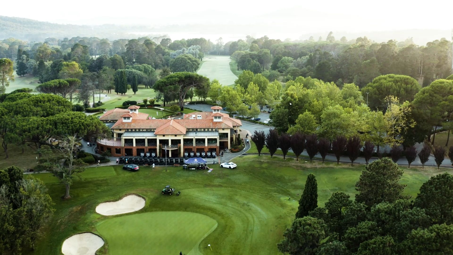 Aerial view of a golf club course and clubhouse