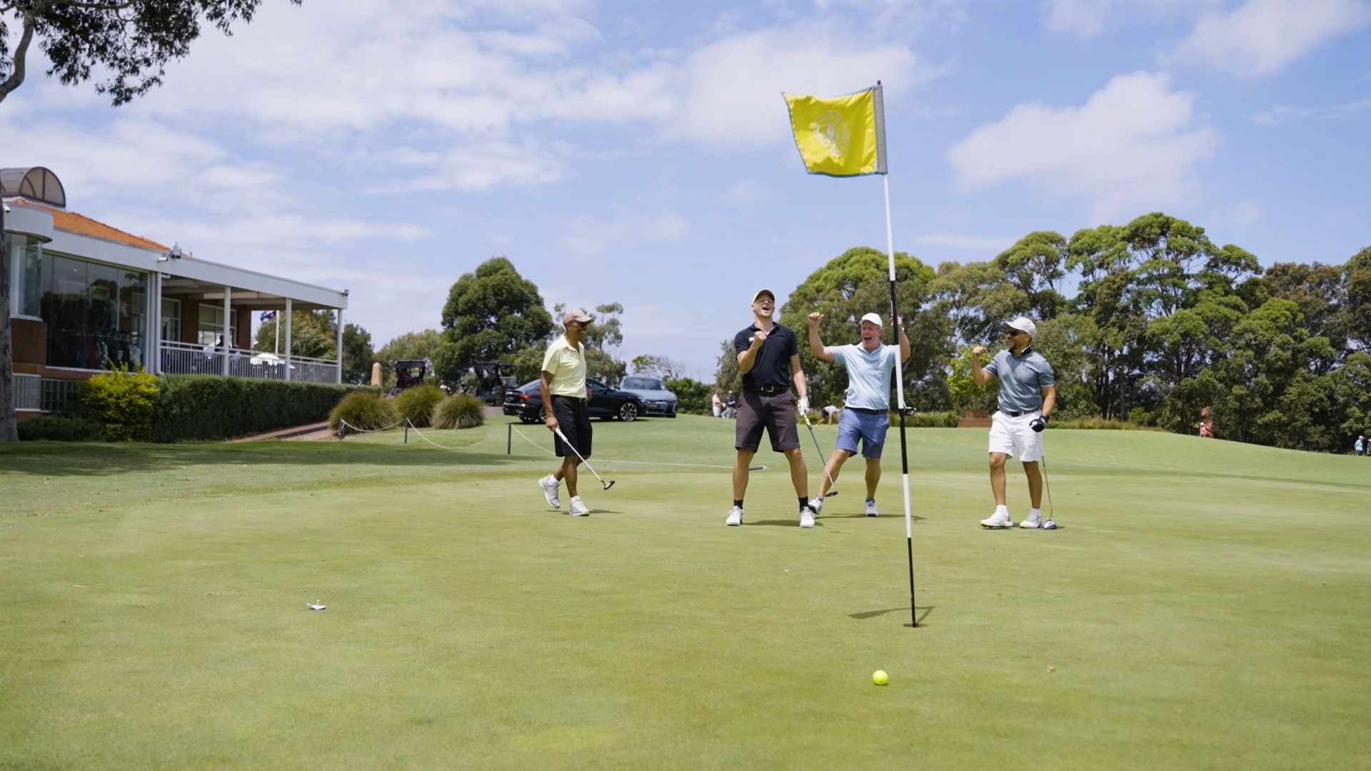 Golfers celebrating on the green at a Golfer Tour event